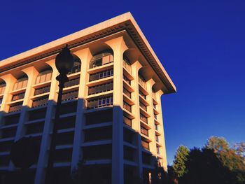 Low angle view of building against clear blue sky