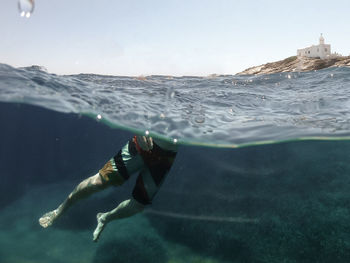 Man swimming in sea