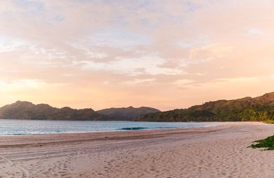 Scenic view of beach against sky