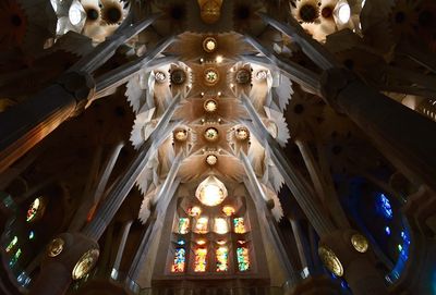 Low angle view of illuminated ceiling in temple