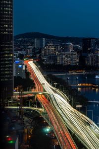 High angle view of light trails on road at night