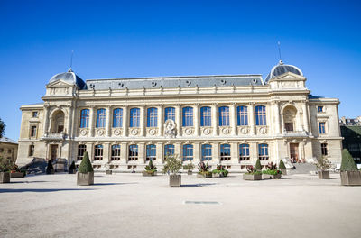 Facade of historic building against blue sky