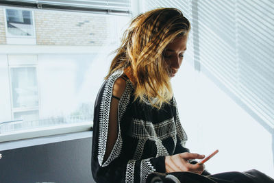 Young woman using mobile phone