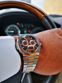 Close-up of hand holding vintage car