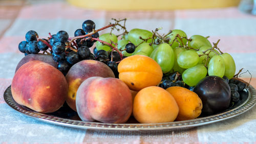 Fruits in plate on table