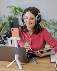 Portrait of young woman using mobile phone