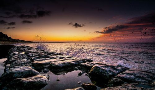Scenic view of sea against sky during sunset