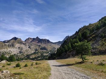 Scenic view of landscape and mountains against sky