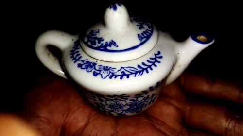 Close-up of human hand holding tea cup