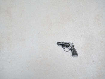 Close-up of handgun with white background