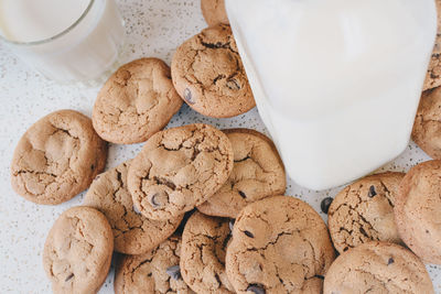 Close-up of cookies and milk bottle