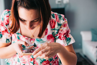 Midsection of woman looking at camera