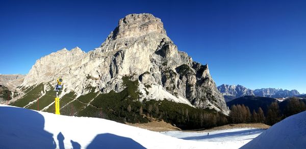 Scenic view of mountains against clear blue sky