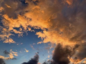 Low angle view of clouds in sky during sunset