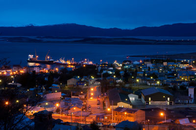 High angle view of illuminated buildings in city at night