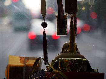 Buddha statue on dashboard in car