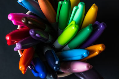 Close-up of multi colored pencils on table