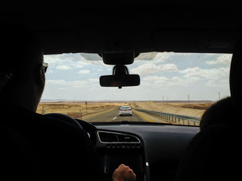 Cropped image of car on road