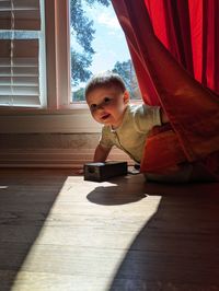 Boy sitting on table
