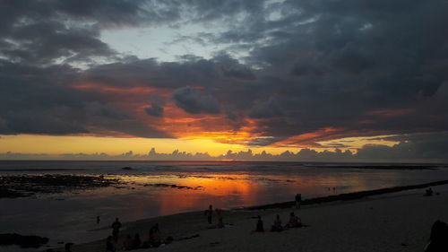 Scenic view of beach against sky during sunset