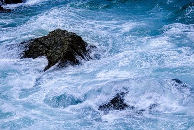 Sea waves splashing on rocks