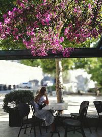 Woman sitting on chair at table