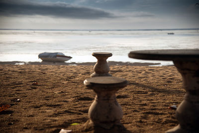 Close-up of beach against sky
