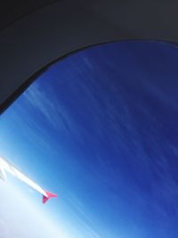 Low angle view of airplane flying in sky