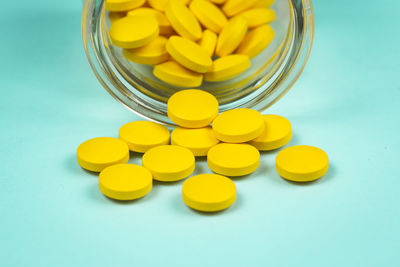 Close-up of yellow jar on table