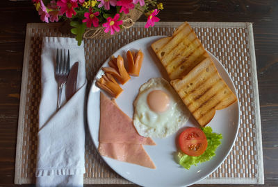 High angle view of breakfast in plate on place mat