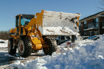 High angle view of vehicles on snow covered road