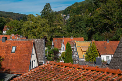 High angle view of houses and trees against sky