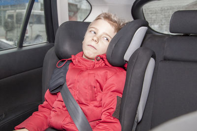 Boy sitting in car