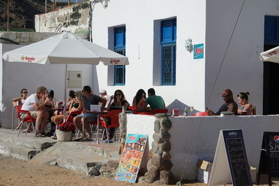 People sitting at town square