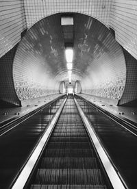 Low angle view of illuminated tunnel