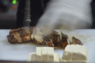 Close-up of meat on barbecue grill