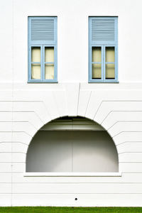 White building seen through closed window