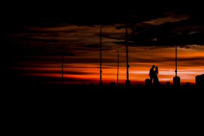 Silhouette people at sunset