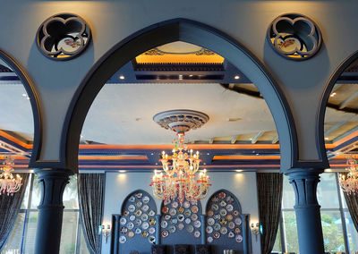 Low angle view of illuminated ceiling of building