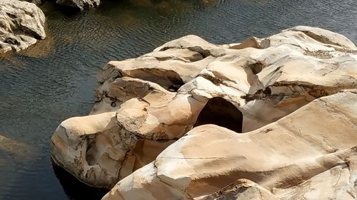 High angle view of rock formation in lake
