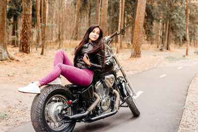 Portrait of a young woman riding motorcycle