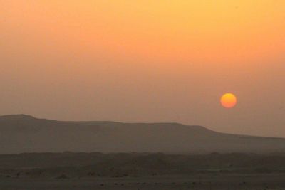 Scenic view of silhouette landscape against sky during sunset