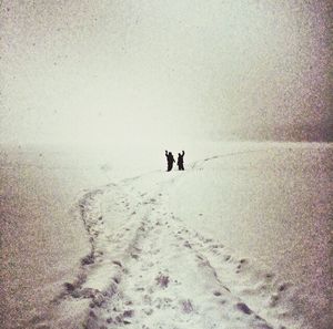 Silhouette of people in winter