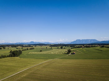 Scenic view of landscape against clear blue sky