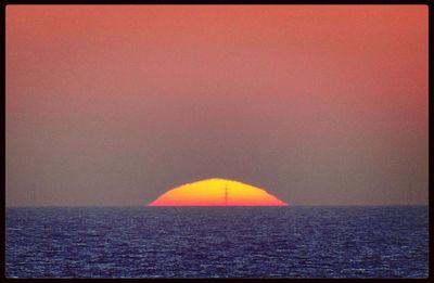 Scenic view of sea at sunset