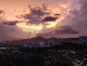 View of town against sky during sunset