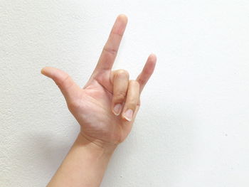 Close-up of human hand against white background