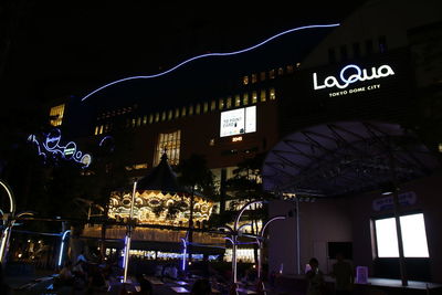 Group of people in market at night