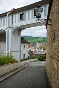 Street amidst buildings against sky