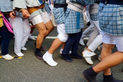 Low section of people standing on floor